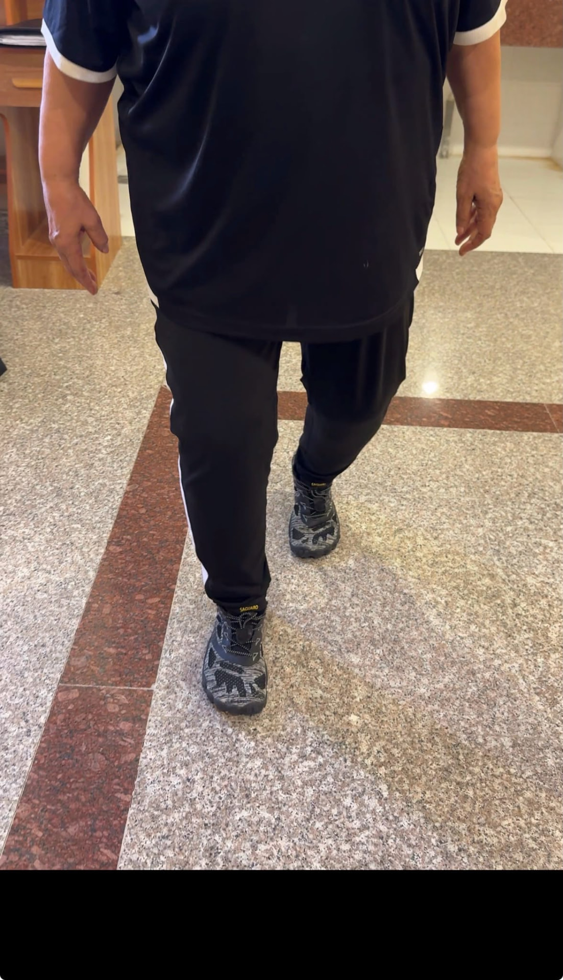 Client walking indoors during a gait and balance assessment